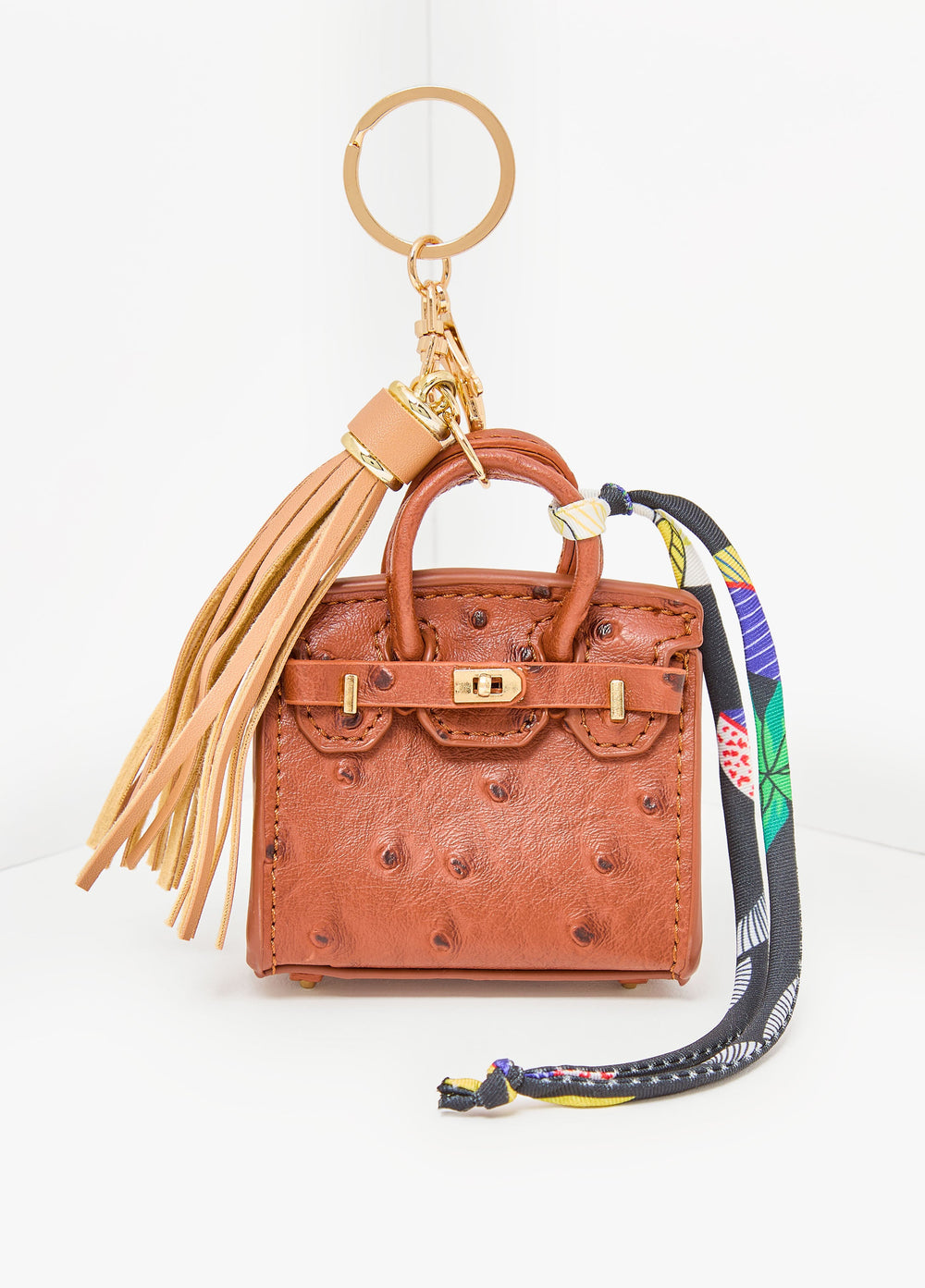 Ostrich Effect Tasseled Bag Charm Brown | Ashley Stewart